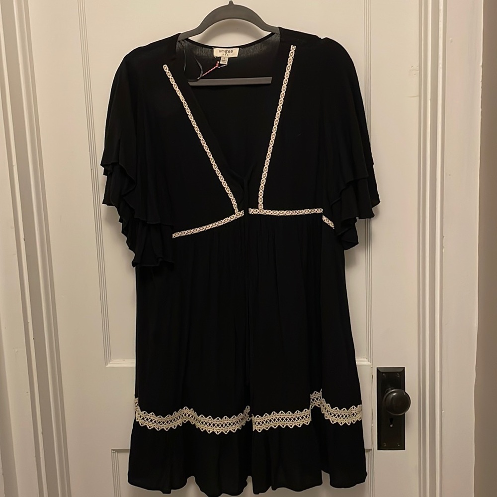 Umber black dress. Ruffle sleeves